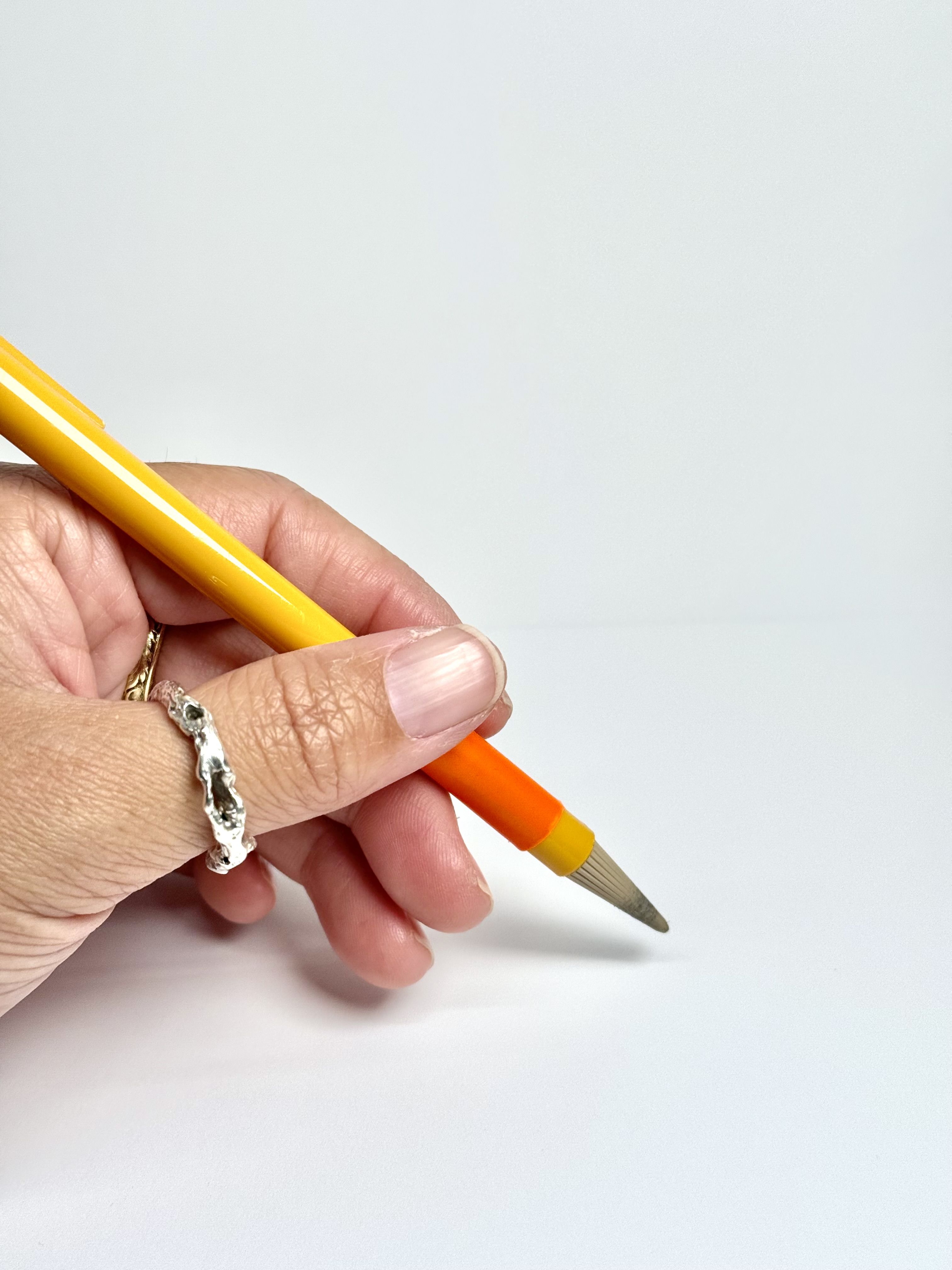 Orange plastidipped pencil, with plastic as grip
